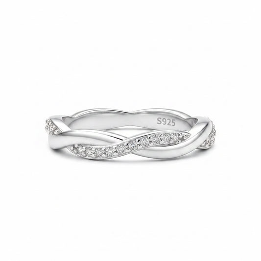 Silver ring with diamond accents on a white background