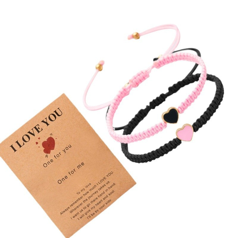 Two braided bracelets with heart charms and a 'I LOVE YOU' card on a white background